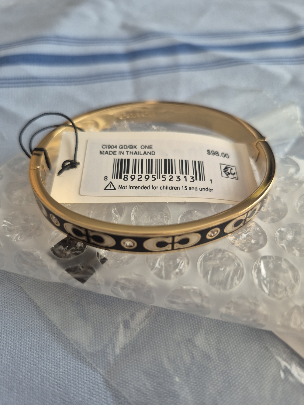 Coach Gold and Black Signature C Turnlock Bangle Bracelet